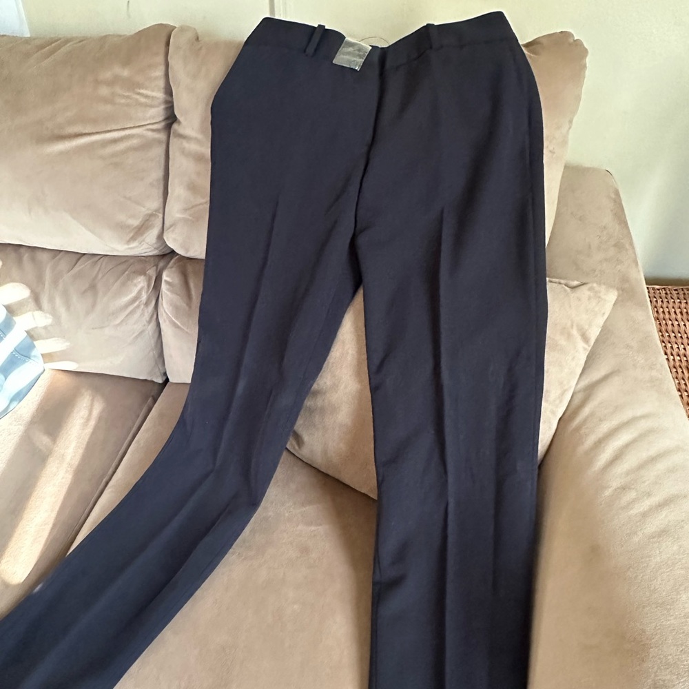 New black petite dress pants . Size 4